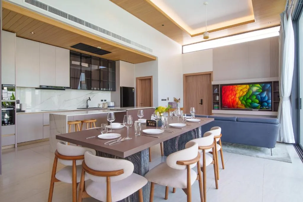 Villa kitchen and dining island with marble countertops