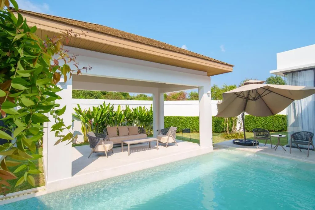 Villa outdoor cabana and pool terrace with tropical garden
